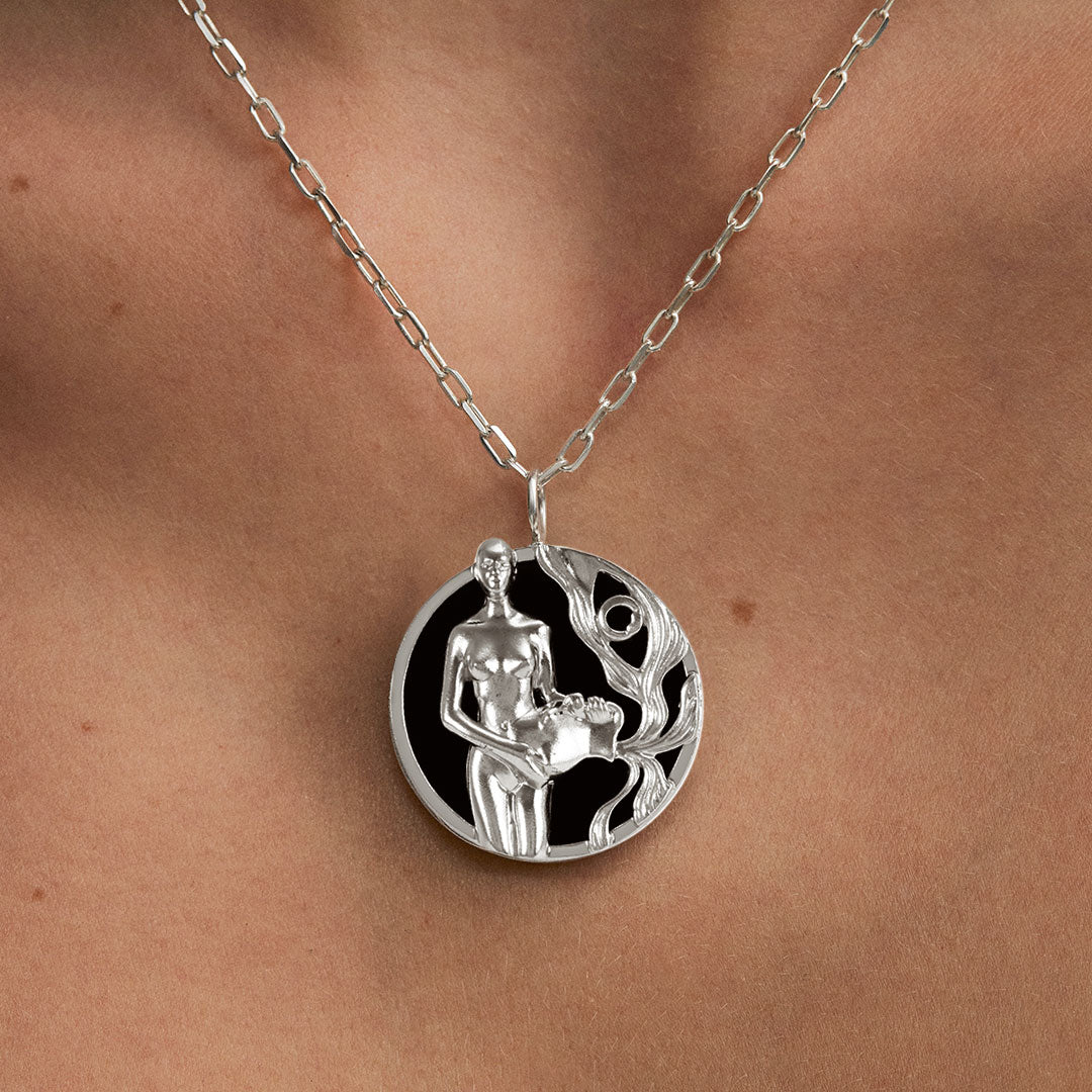 Model wearing Aquarius zodiac necklace in sterling silver