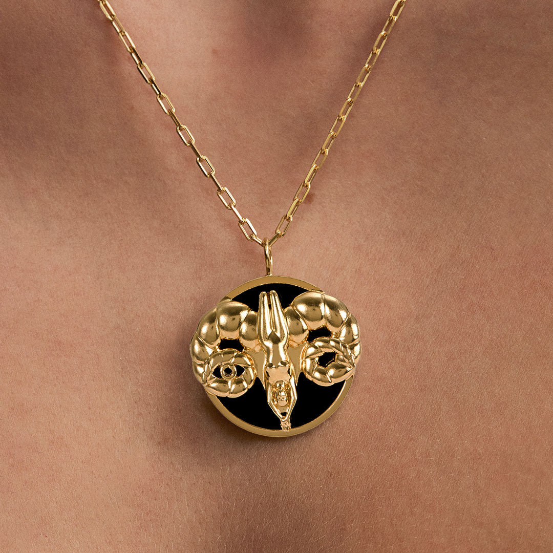 Model wearing Aries zodiac necklace in sterling silver with 18k gold plating