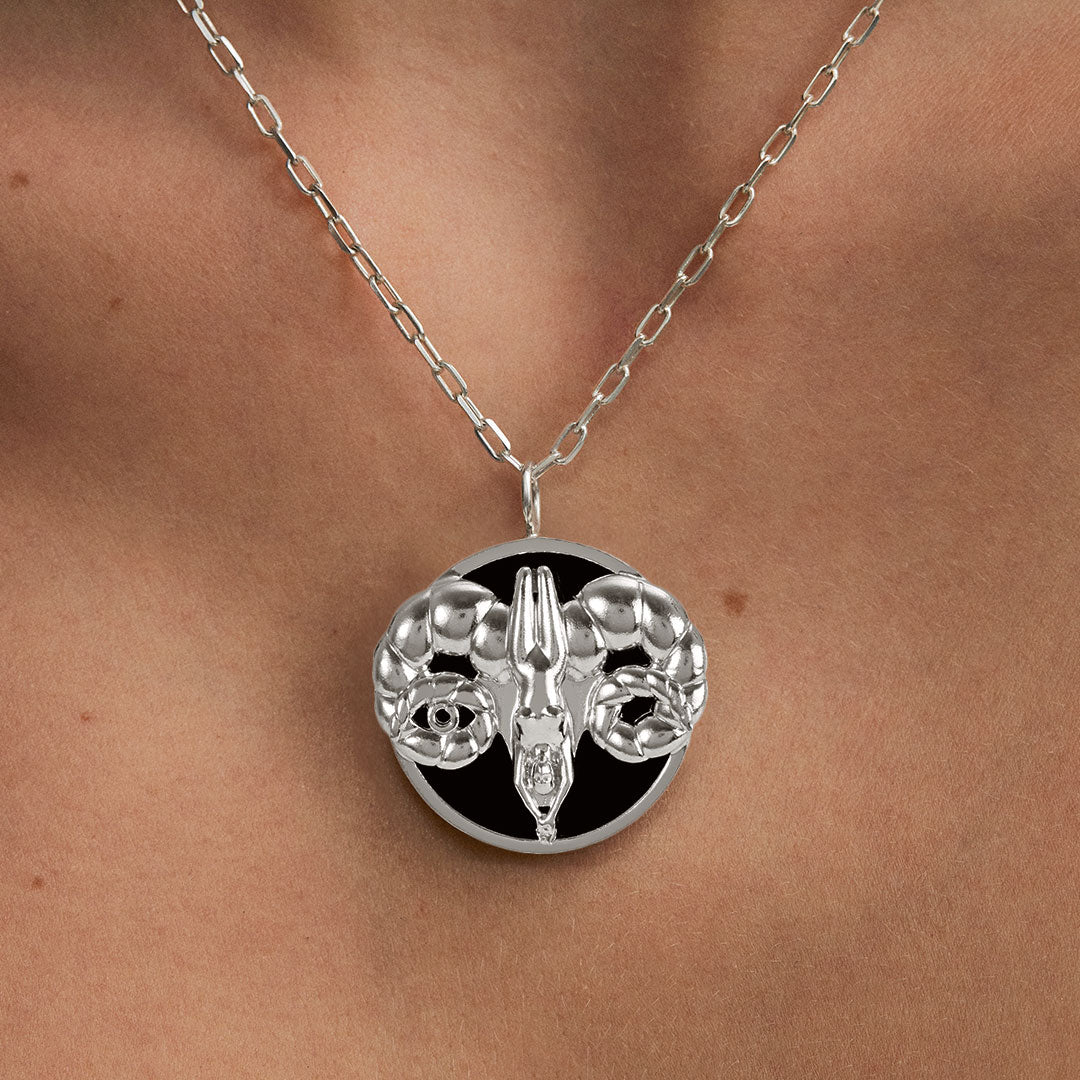 Model wearing Aries zodiac necklace in sterling silver