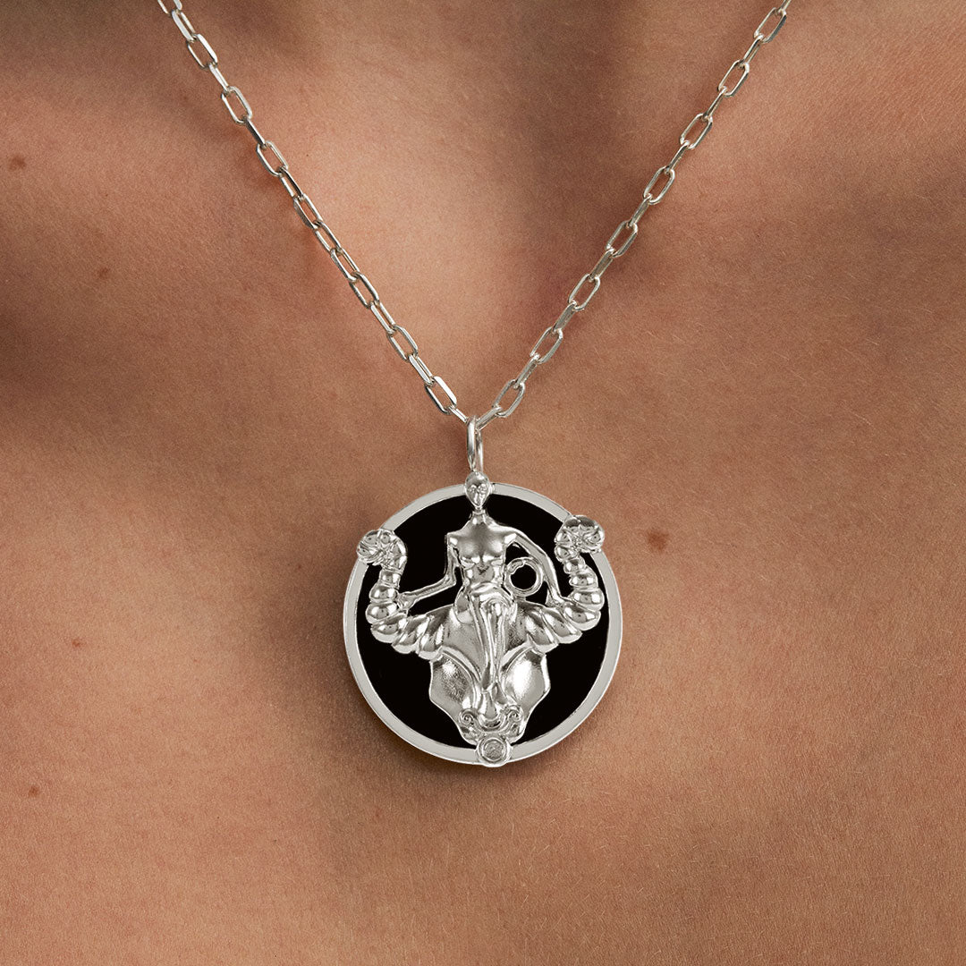 Model wearing Taurus zodiac necklace in sterling silver