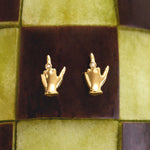 18k gold middle finger earrings adorned with diamonds