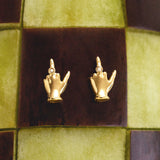 18k gold middle finger earrings adorned with diamonds