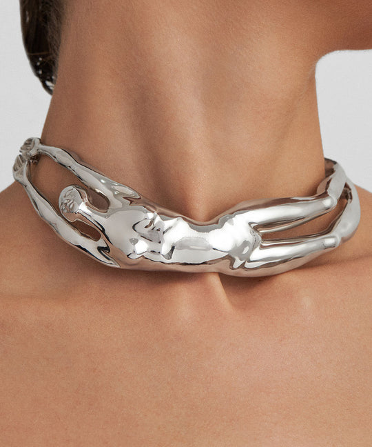 Model wearing a sterling silver choker of a female body