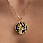 Model wearing Aquarius zodiac necklace in sterling silver with 18k gold plating