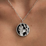 Model wearing Aquarius zodiac necklace in sterling silver