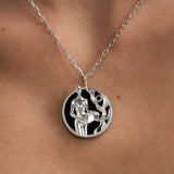 Model wearing Aquarius zodiac necklace in sterling silver
