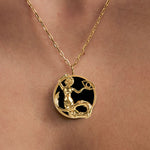 Model wearing Capricorn zodiac necklace in sterling silver with 18k gold plating
