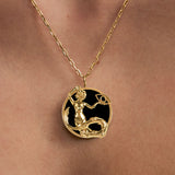 Model wearing Capricorn zodiac necklace in sterling silver with 18k gold plating