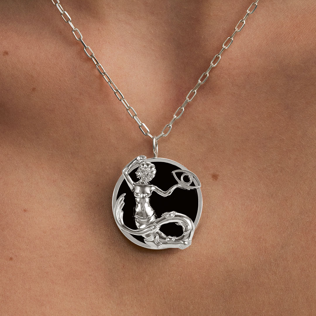 Model wearing Capricorn zodiac necklace in sterling silver