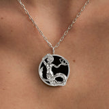 Model wearing Capricorn zodiac necklace in sterling silver