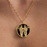 Model wearing Gemini zodiac necklace in sterling silver with 18k gold plating