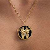 Model wearing Gemini zodiac necklace in sterling silver with 18k gold plating