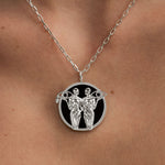 Model wearing Gemini zodiac necklace in sterling silver