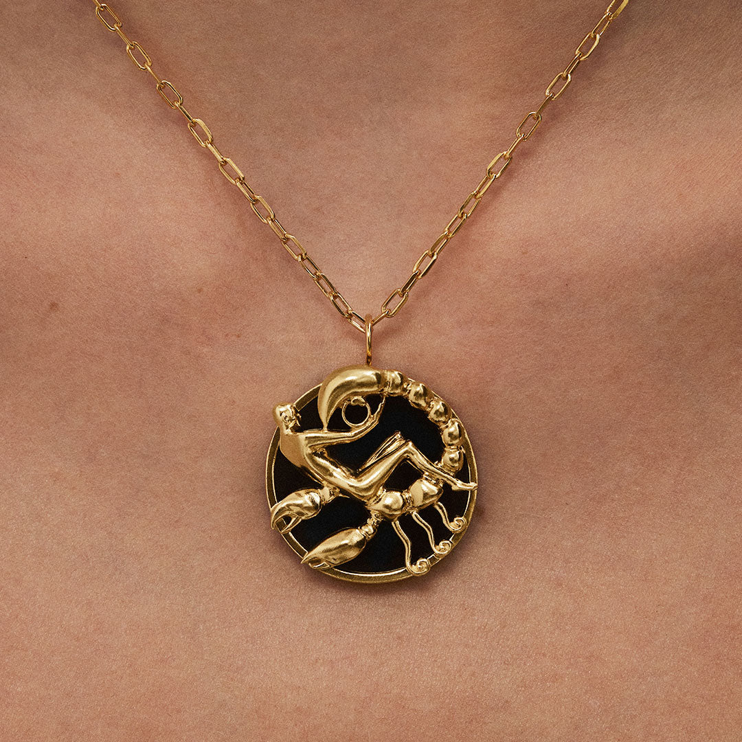 Model wearing Scorpio zodiac necklace in sterling silver with 18k gold plating