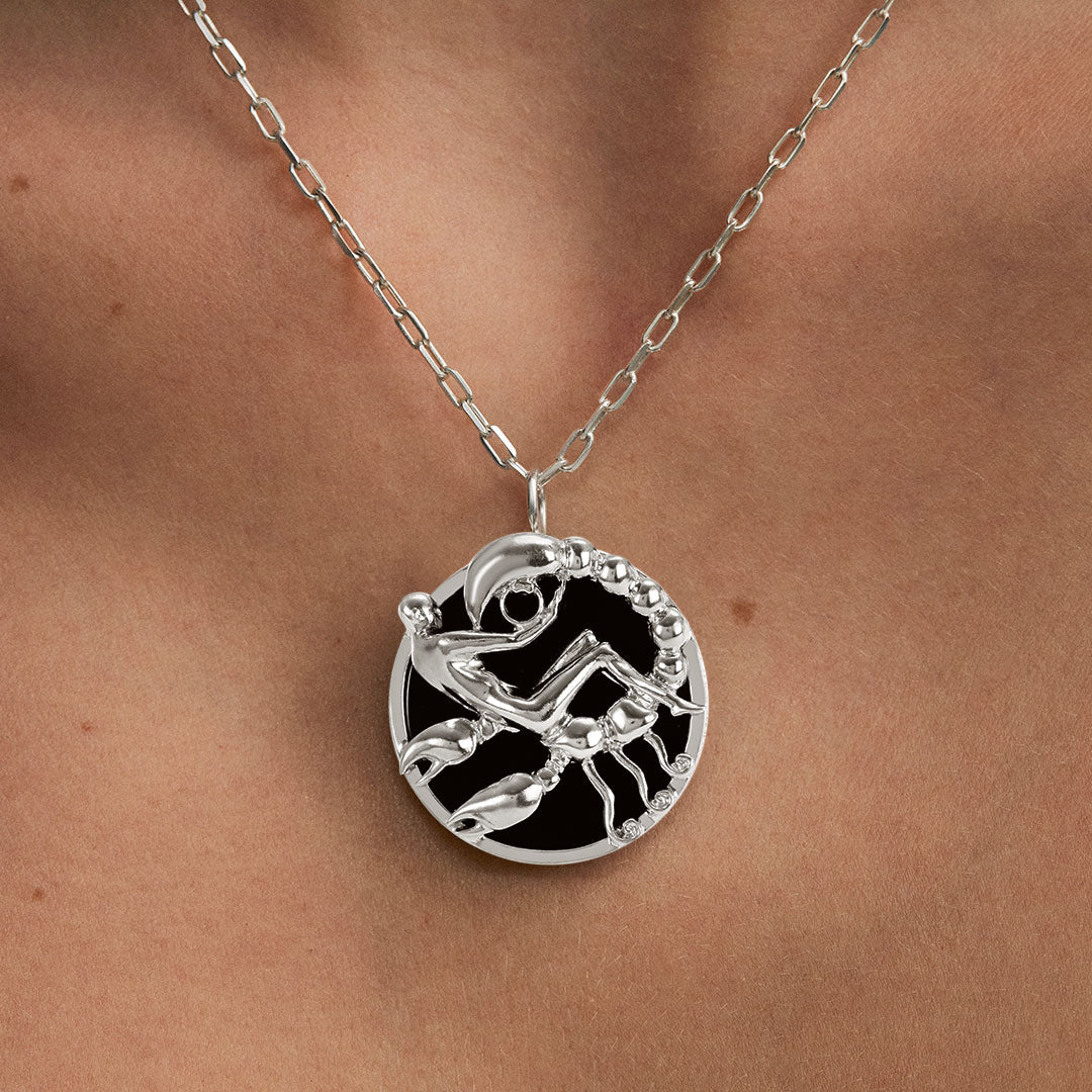 Model wearing Scorpio zodiac necklace in sterling silver
