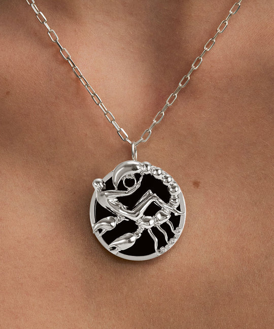 Model wearing Scorpio zodiac necklace in sterling silver