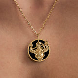 Model wearing Taurus zodiac necklace in sterling silver with 18k gold plating