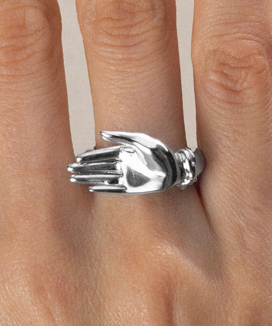 Model wearing a palm ring in sterling silver