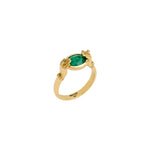 Paola Vilas 18k gold hands ring adorned with diamonds and an oval emerald