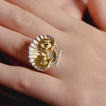 Video of a model wearing a sterling silver ring with 18k gold plating of women in a shell