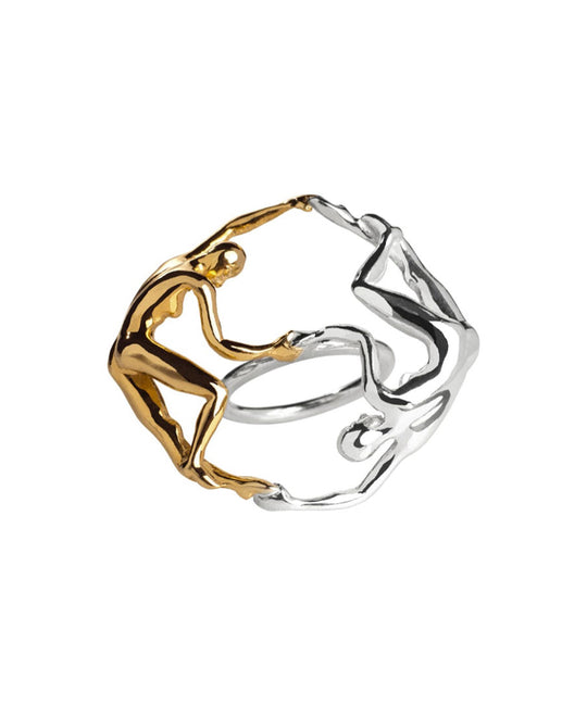 Sculptural ring of intertwined dancing bodies in sterling silver with 18k gold plating