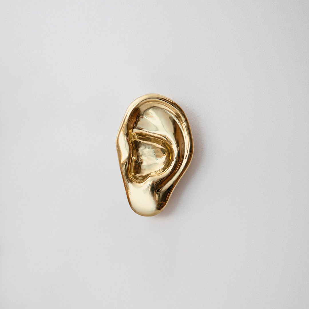 Brass wall sculpture of an ear